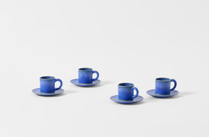 Four Christiane Perrochon bright blue espresso cups with saucers.