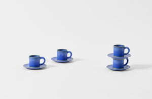 Four Christiane Perrochon bright blue espresso cups with saucers.