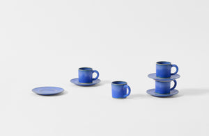 Four Christiane Perrochon bright blue espresso cups with saucers.