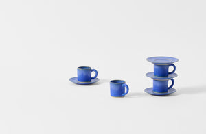 Four Christiane Perrochon bright blue espresso cups with saucers.