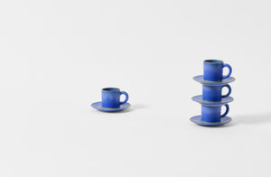 Four Christiane Perrochon bright blue espresso cups with saucers.