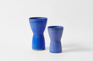 Christiane Perrochon bright blue large hourglass vase with bright blue medium hourglass vase.
