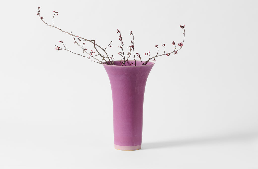 Extra small Christiane Perrochon flared fuchsia vase with cherry blossoms.