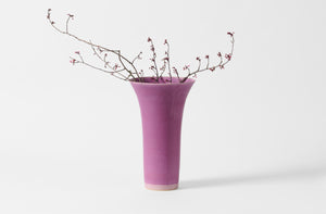 Extra small Christiane Perrochon flared fuchsia vase with cherry blossoms.