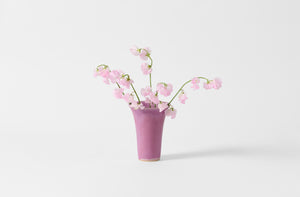 Extra small Christiane Perrochon flared fuchsia vase with light pink sweet peas.