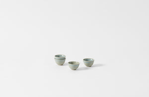 Four Christiane Perrochon iron blue sake cups.