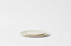 Christiane Perrochon nested powder white oval dinnerware. Default