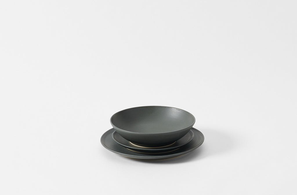Set of black ceramic bowls on a white background. Default