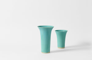 Large and small Christiane Perrochon flared turquoise vases. 