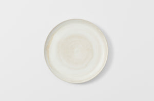 Christiane Perrochon powder white beige round footed platter overhead.