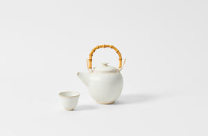 Christiane Perrochon white beige medium teapot with bamboo handle with teacup.