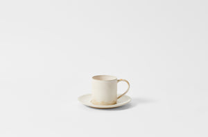 Christiane Perrochon white beige tall mug and saucer. Default