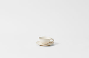 Christiane Perrochon white beige teacup and saucer.
