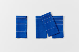 Four folded Chroma cobalt stripe napkins 