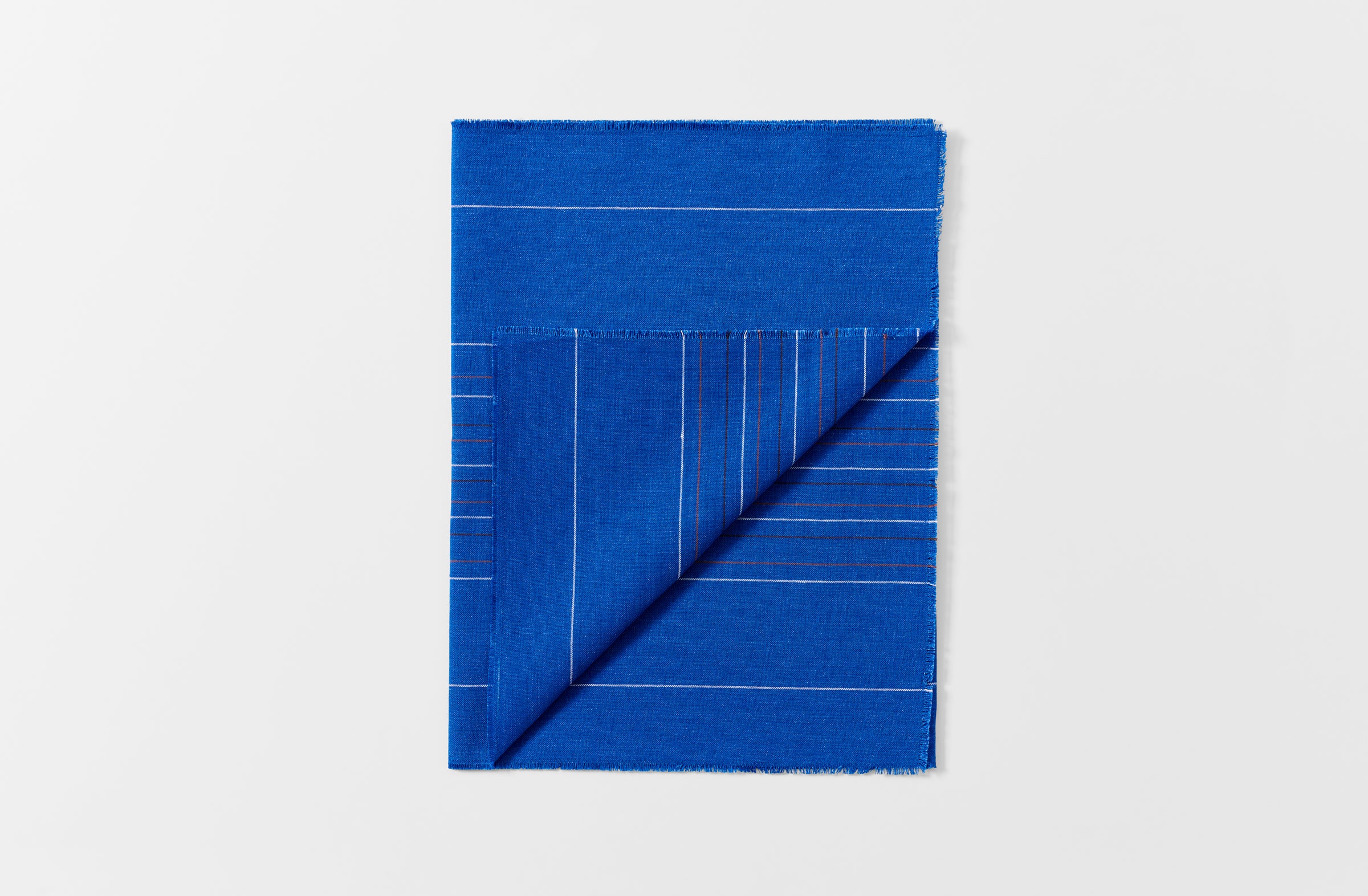 Chroma cobalt stripe runner folded with detail of reverse