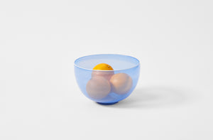 Davide Fuin blue filigree round bowl holding oranges