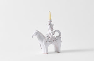 Equestre small ceramic candle holder with candle.