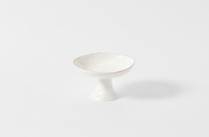 Feldspar Studio red rim fruit bowl.