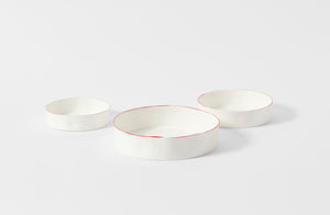 Feldspar Studio red rim nesting bowls. Default