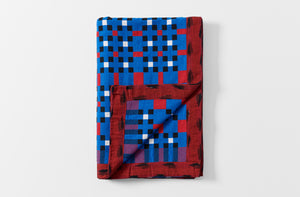 Gregory Parkinson electric berry azul classic check pattern blanket folded with detail of reverse
