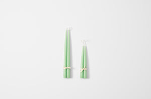 Hand dipped apple green taper candles.