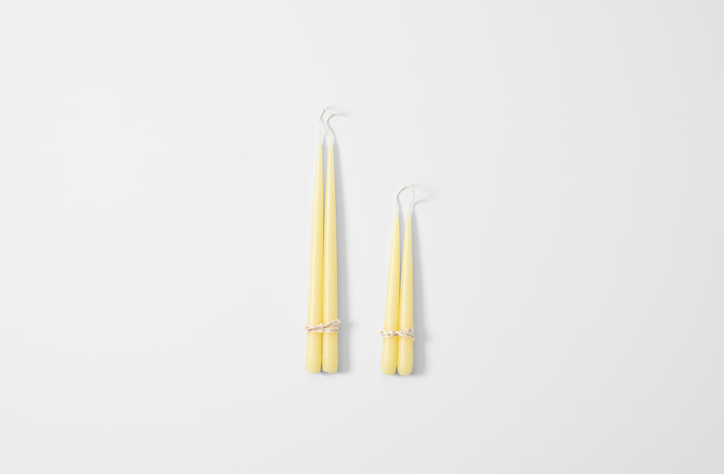 Hand-dipped butter taper candles.
