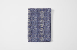 Hand-printed Venice indigo linen tablecloth folded.