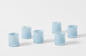 Group of six Henry Dean glass votives in cloud blue