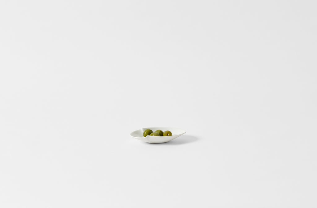 Hering Berlin petite white evolution oval dish holding olives.