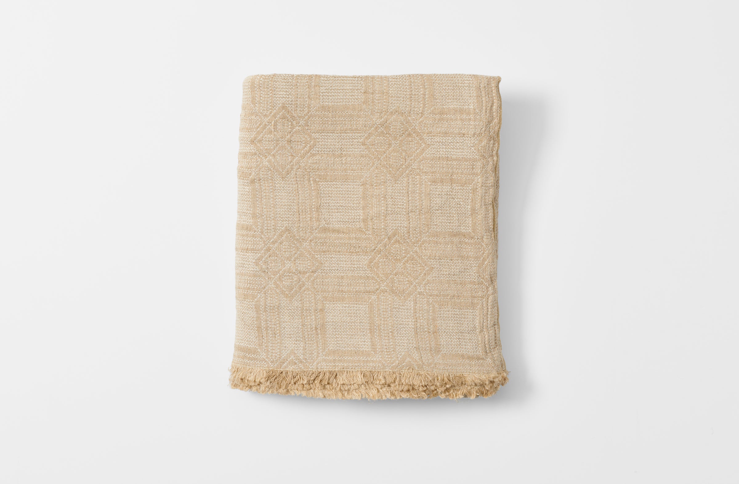 Homespun natural tablecloth folded.