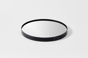 Ifuji black round mirror laying flat with detail of frame.