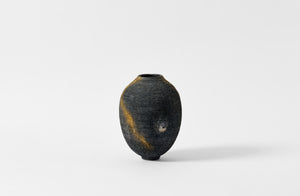 karen swami black ember smoke fired vessel with gold kintsugi.