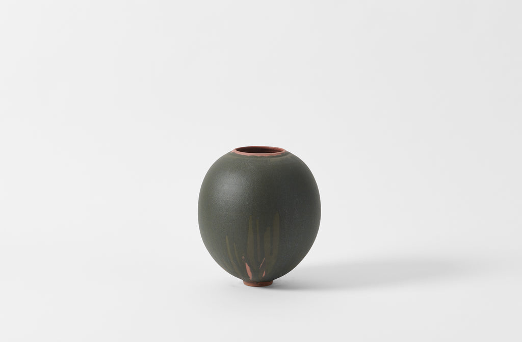 Karen Swami black glaze on red stoneware round vase.