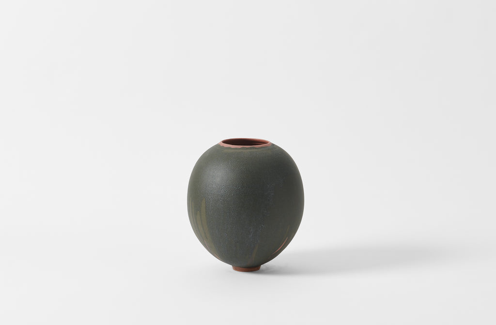 Karen Swami black glaze on red stoneware round vase.
