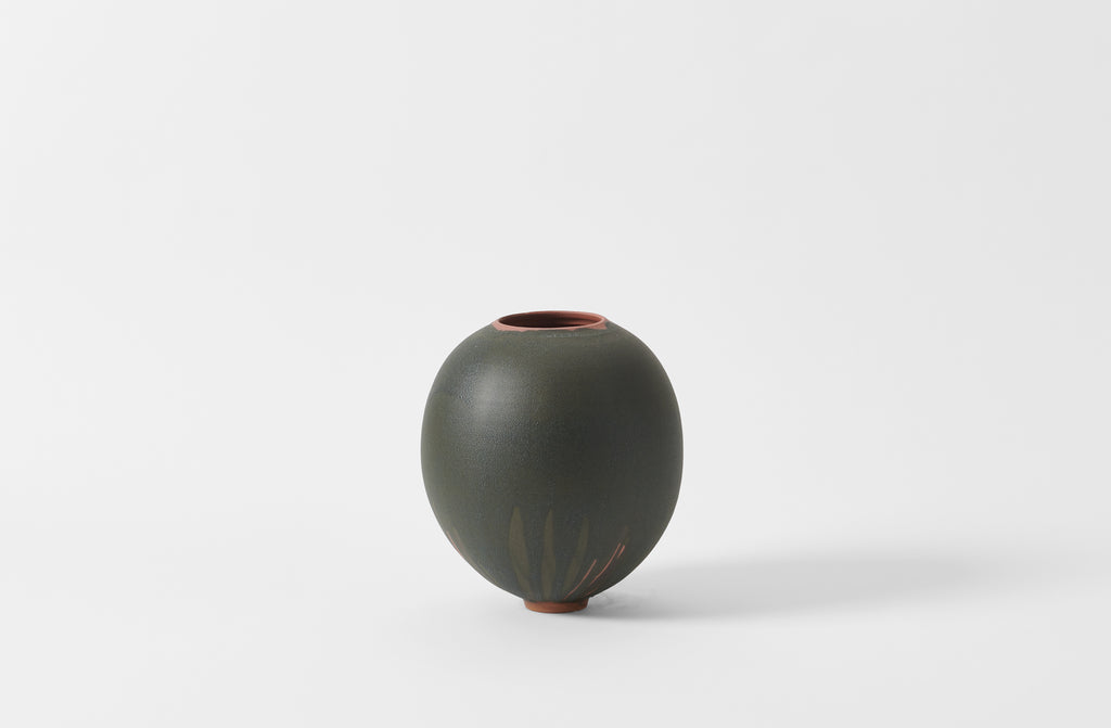 Karen Swami black glaze on red stoneware round vase.