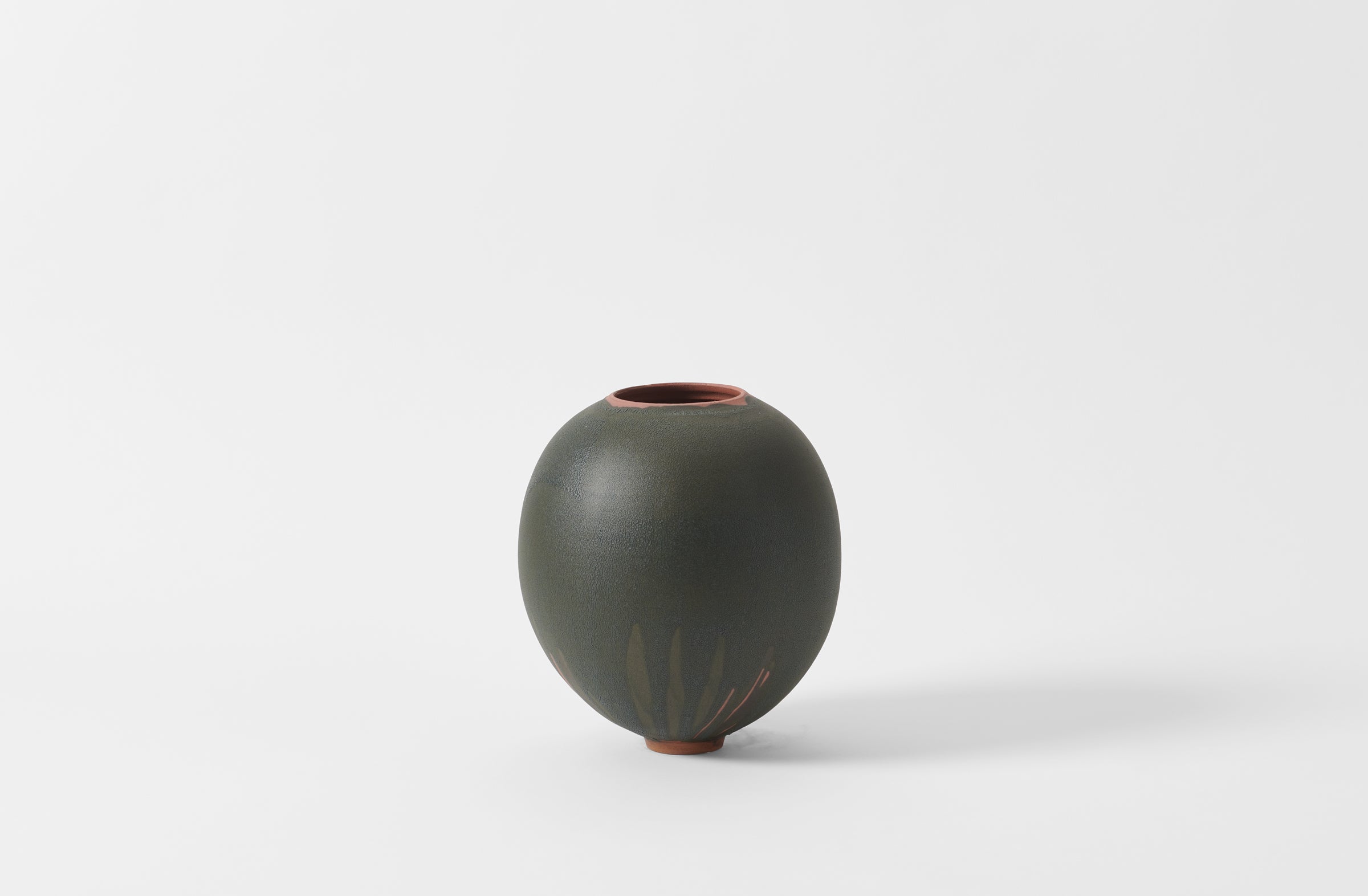 Karen Swami black glaze on red stoneware round vase.