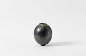 Karen Swami smoke fired vessel with gold kintsugi.