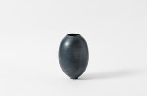 Karen Swami tall smoke fired vessel with gold kintsugi.