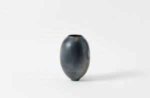 Karen Swami tall smoke fired vessel with gold kintsugi.