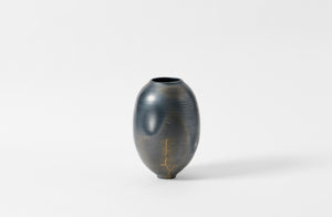 Karen Swami tall smoke fired vessel with gold kintsugi.