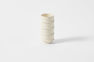 Four Kelly Wearstler alabaster Dune cups stacked