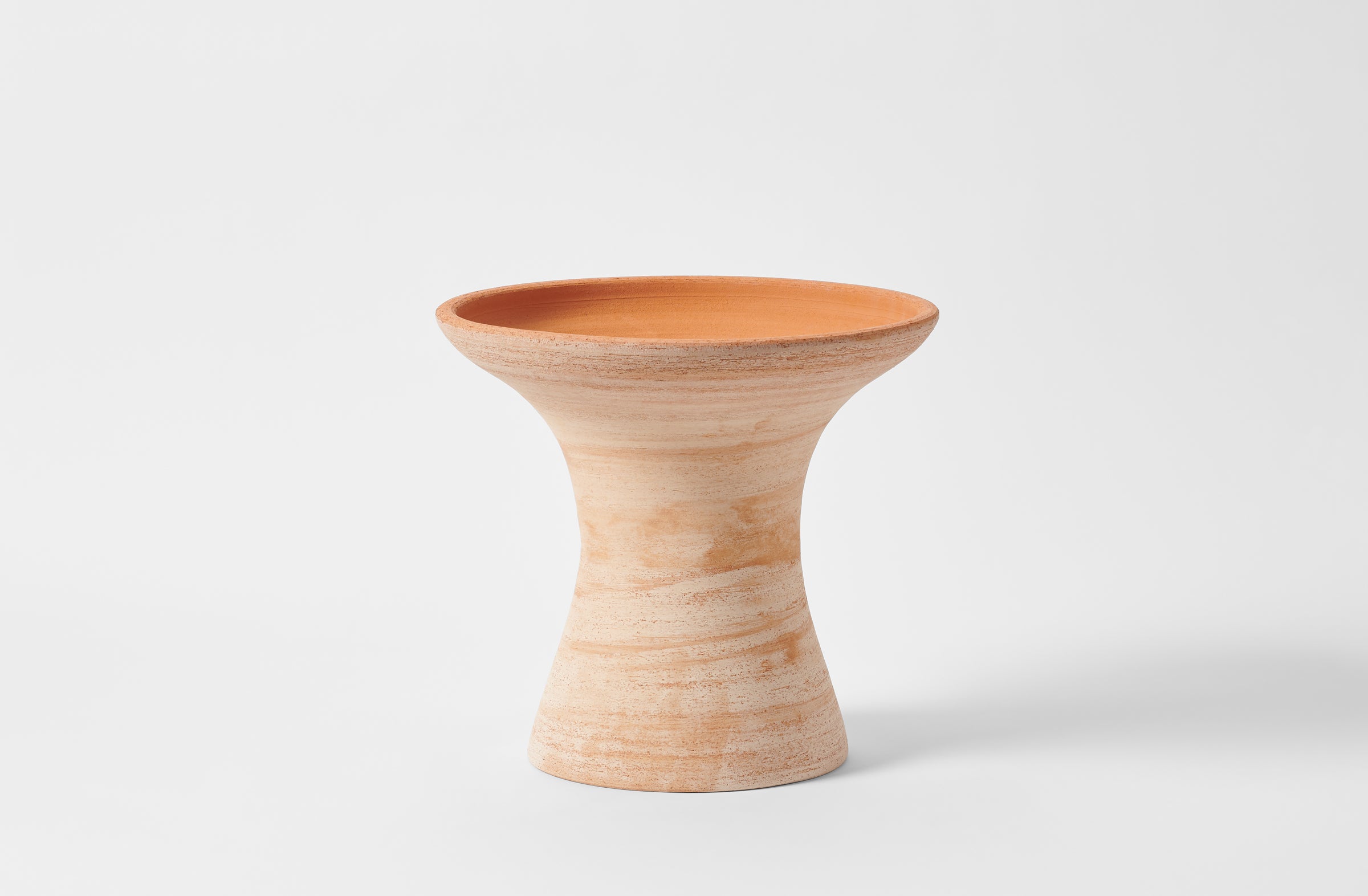 Large terracotta pedestal pot.