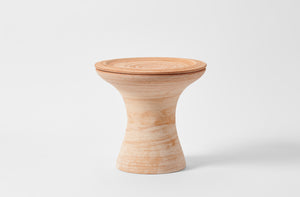 Large terracotta pedestal pot as table.