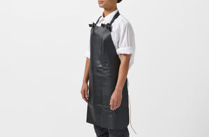 Model wearing Malle W. Trousseau black leather apron.