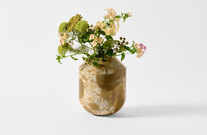 Medium breccia adriana Michael Verheyden vasque vase with floral arrangement.