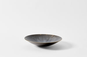 Small brass Michael Verheyden black and white resin bowl.