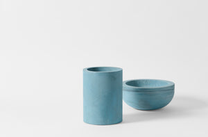 Turquoise Michael Verheyden wide concrete vase and bowl.