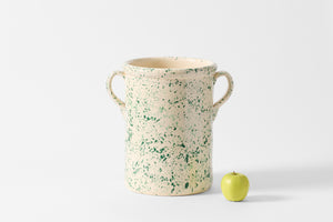 Double green splatterware tall pot with handles with bright green apple.