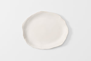 Large white Molosco  serving platter with gold rim overhead detail.