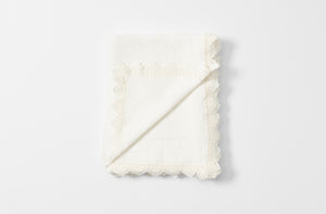Off white Sicily tablecloth folded with detail of reverse